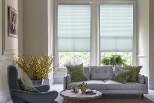 duck egg, teal Pleated blinds have been fitted to multiple windows in a luxuriously styled kitchen in marble and white. Allegro Teal has a geometric style that complements the room.