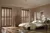 Neutral bedroom with wooden bed with white bedding and beige accessories two floor to ceiling windows dressed in mid-colour wood shutters, louvres open with light rays filling room.